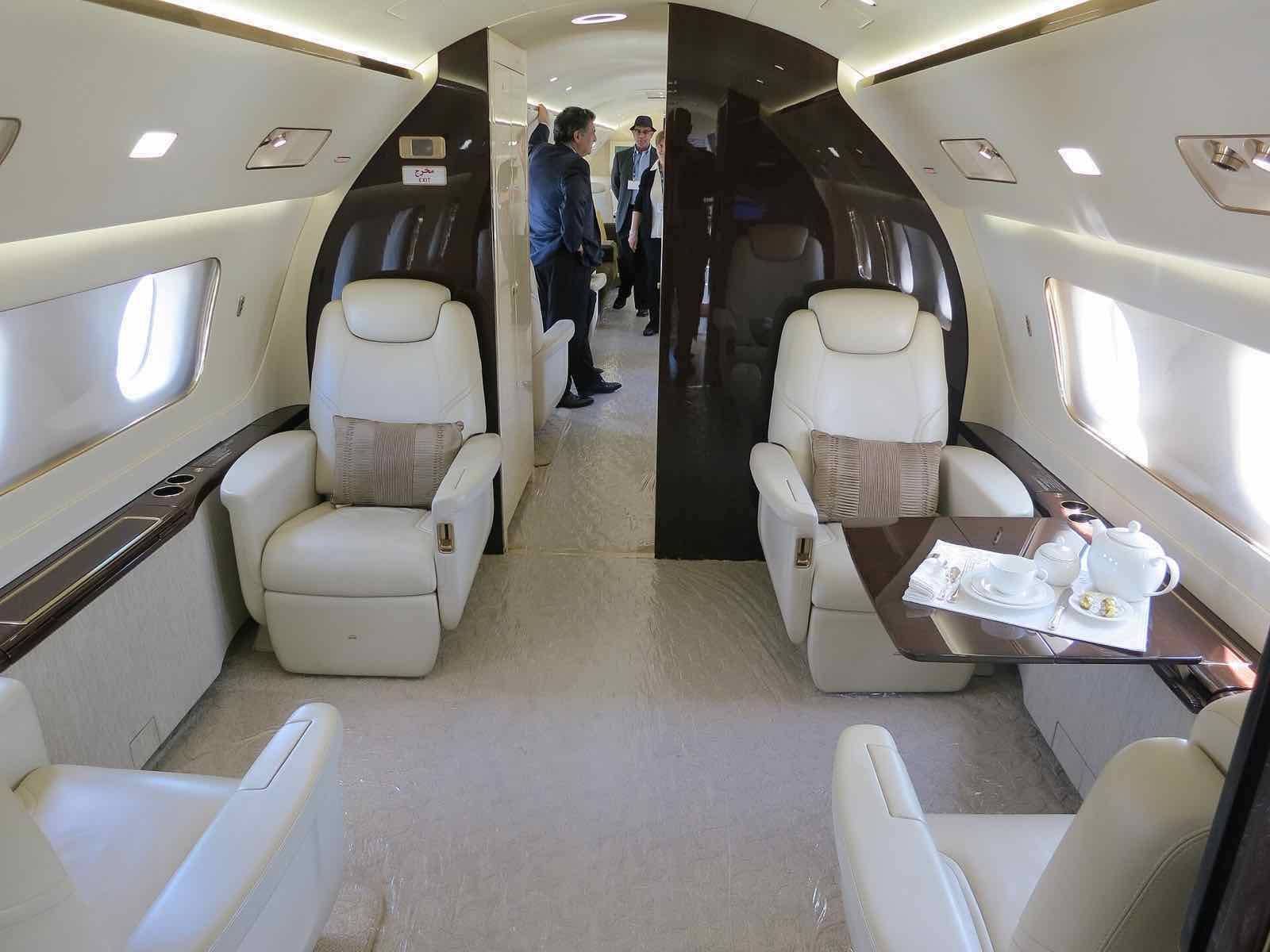 Embraer Lineage 1000 interior forward cabin with passengers